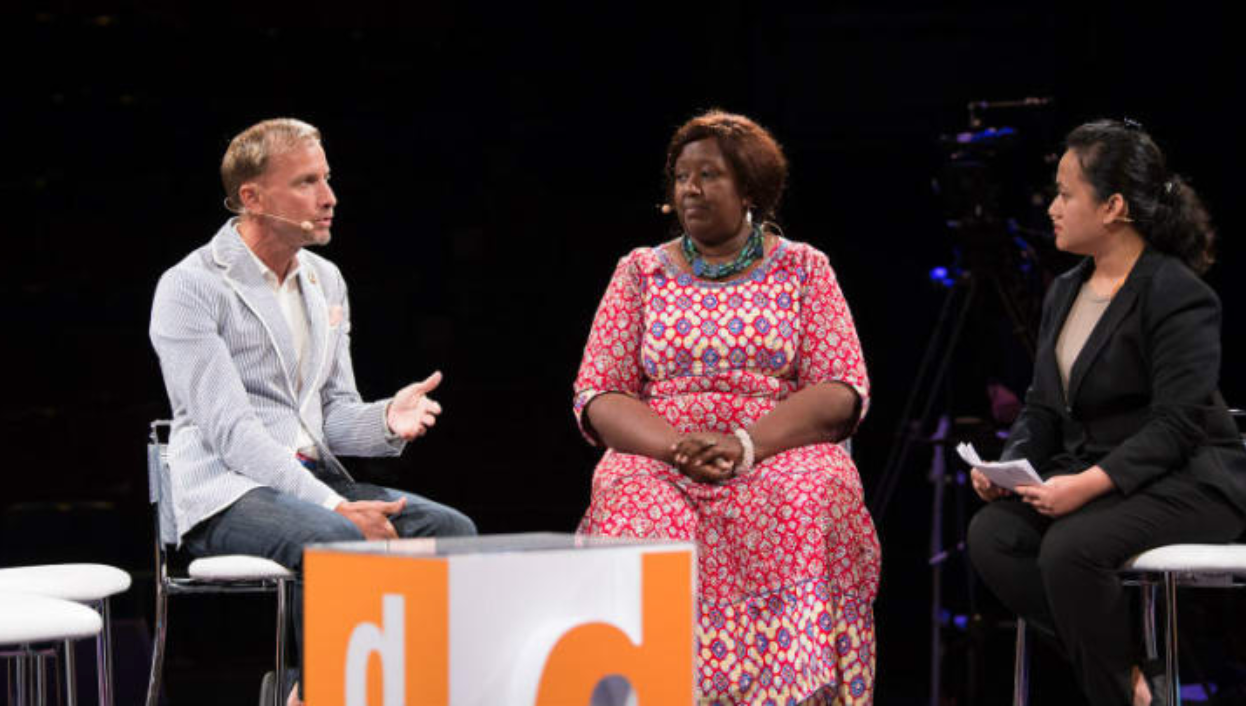 Mark Dybul (left) during a panel session at Devex World 2018. Photo by: Devex