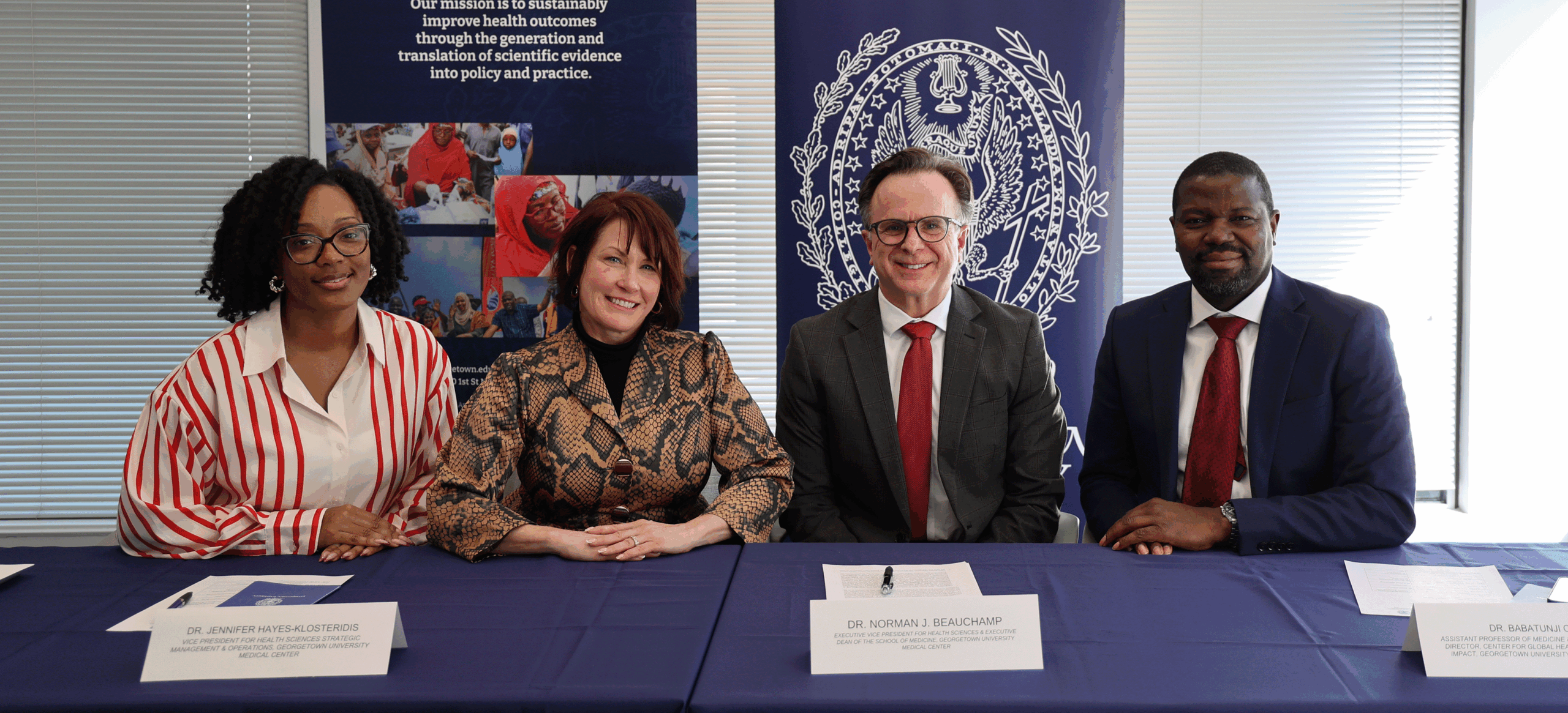 Four staff members from CGHPI and GUMC pose for picture during the GU-CARPHA MOU signing ceremony