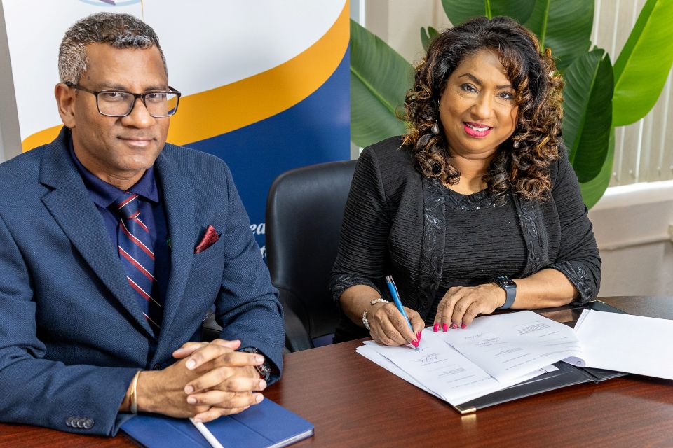 Dr. Mark Sami and Dr. Lisa Indar of CARPHA signing new agreement with Georgetown University.